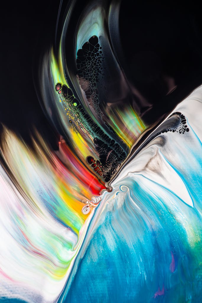 Dynamic abstract artwork featuring vibrant swirling colors and motion effects.